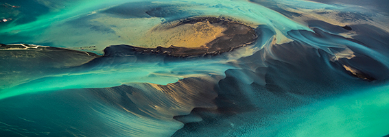 Aerial view of turquoise waterways swirling around sandbars