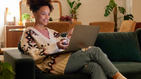 hero-cheerful-female-entrepreneur-watching-movie-on-laptop-thumbnail